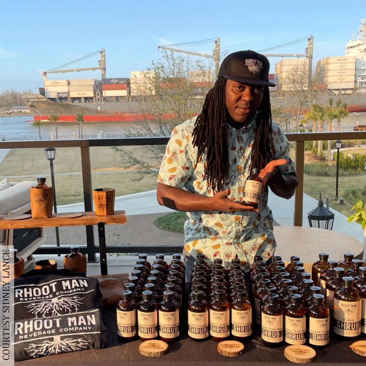 Sidney Lance displays his Rhoot Man Beverage Co. shrubs