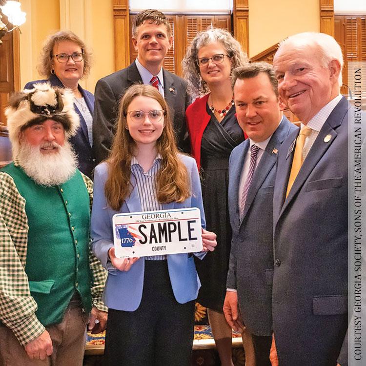 Eden Pethel posing with License plate