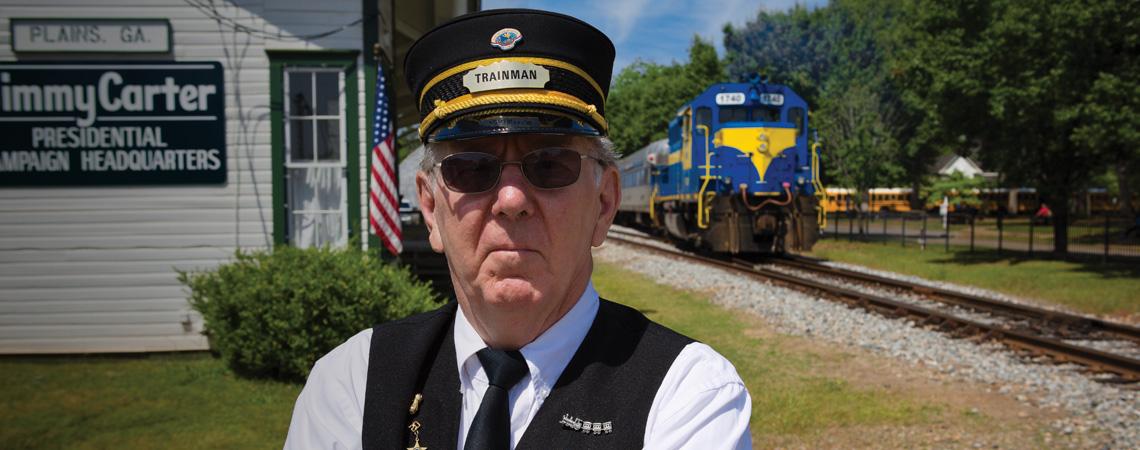 A conductor waits for the SAM Shortline Train in Plains