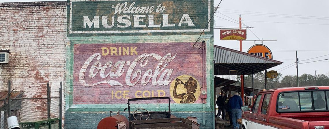 A classic Coca-Cola mural graces the side of the C.F. Hays and Sons General Store in Musella