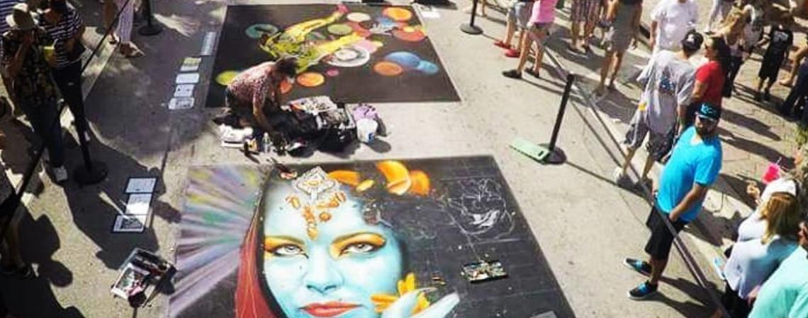 Chalk artists create streetside masterpieces for a crowd