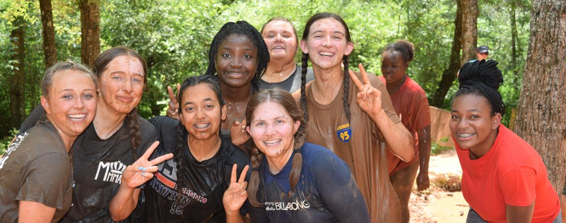 Campers get muddy at an activity at Ga Cooperative Council's youth camp
