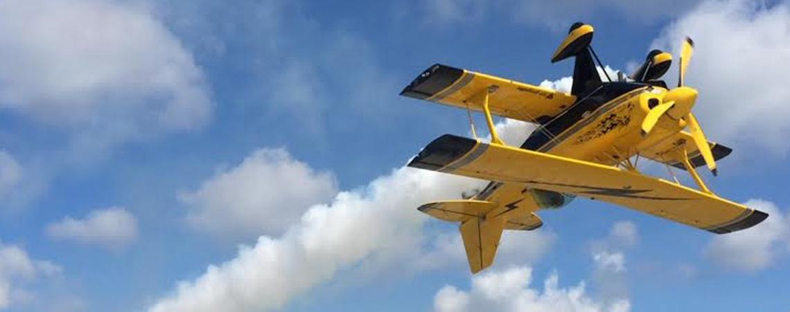 Stunt plane flies upside down at air show