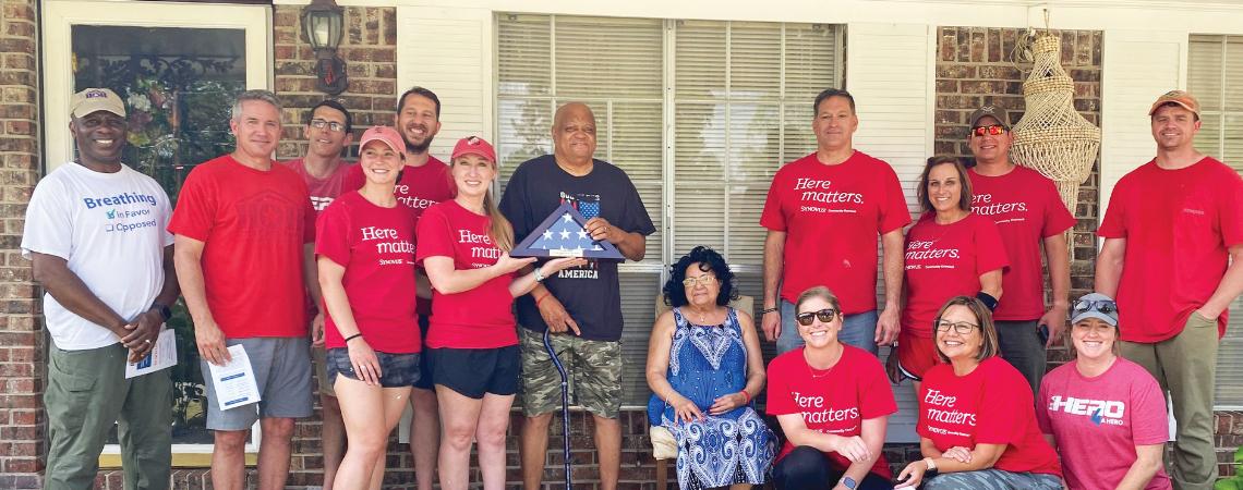 House of Heroes volunteers help with a home project for a veteran