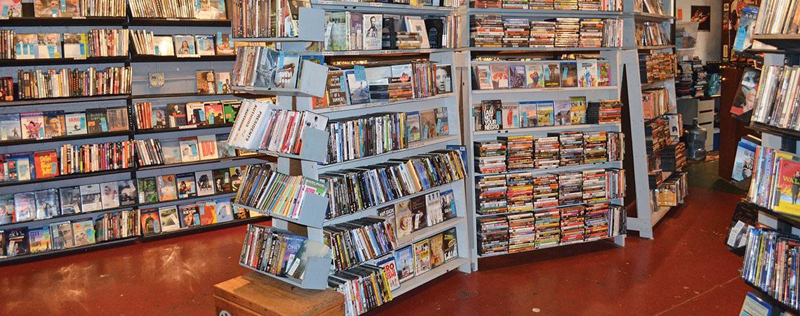 inside of video store, shelves of movies