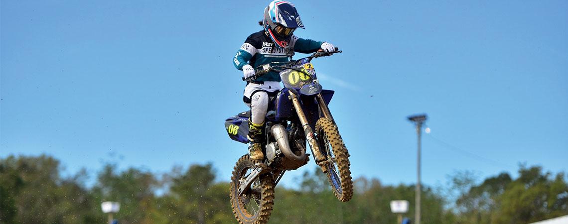 girl on motorbike in air